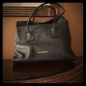 Burberry leather tote bag with golden hardware.